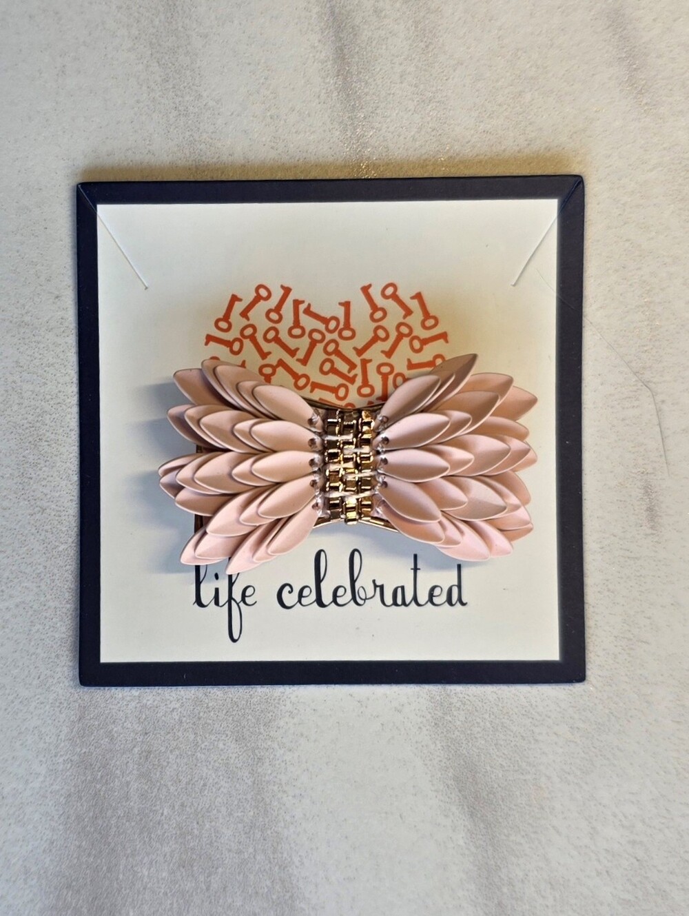 KEEP Collective "Pegasus" feathered pink and rose gold sliding focal charm.